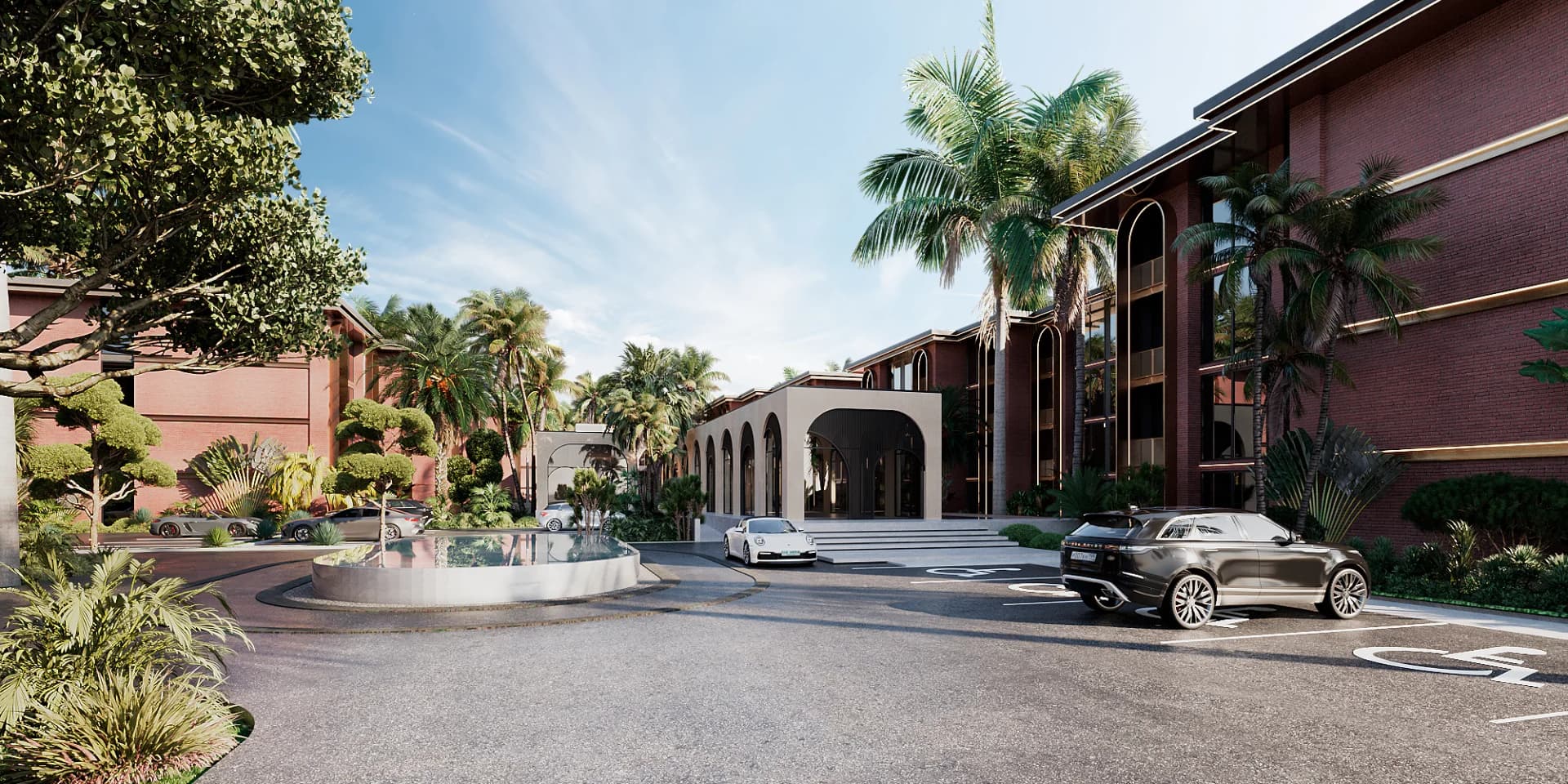 The arrival roundabout with its fountain and the arched clubhouse between the buildings